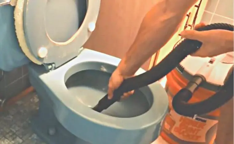 How do you use a vacuum flush toilet