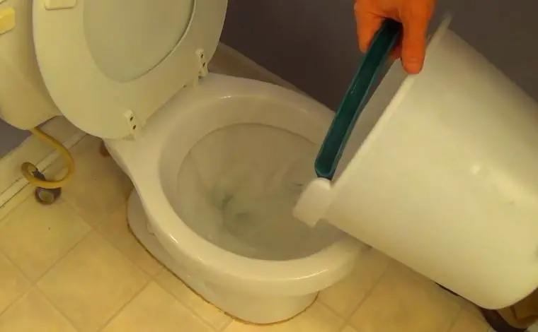 pouring hot water in toilet
